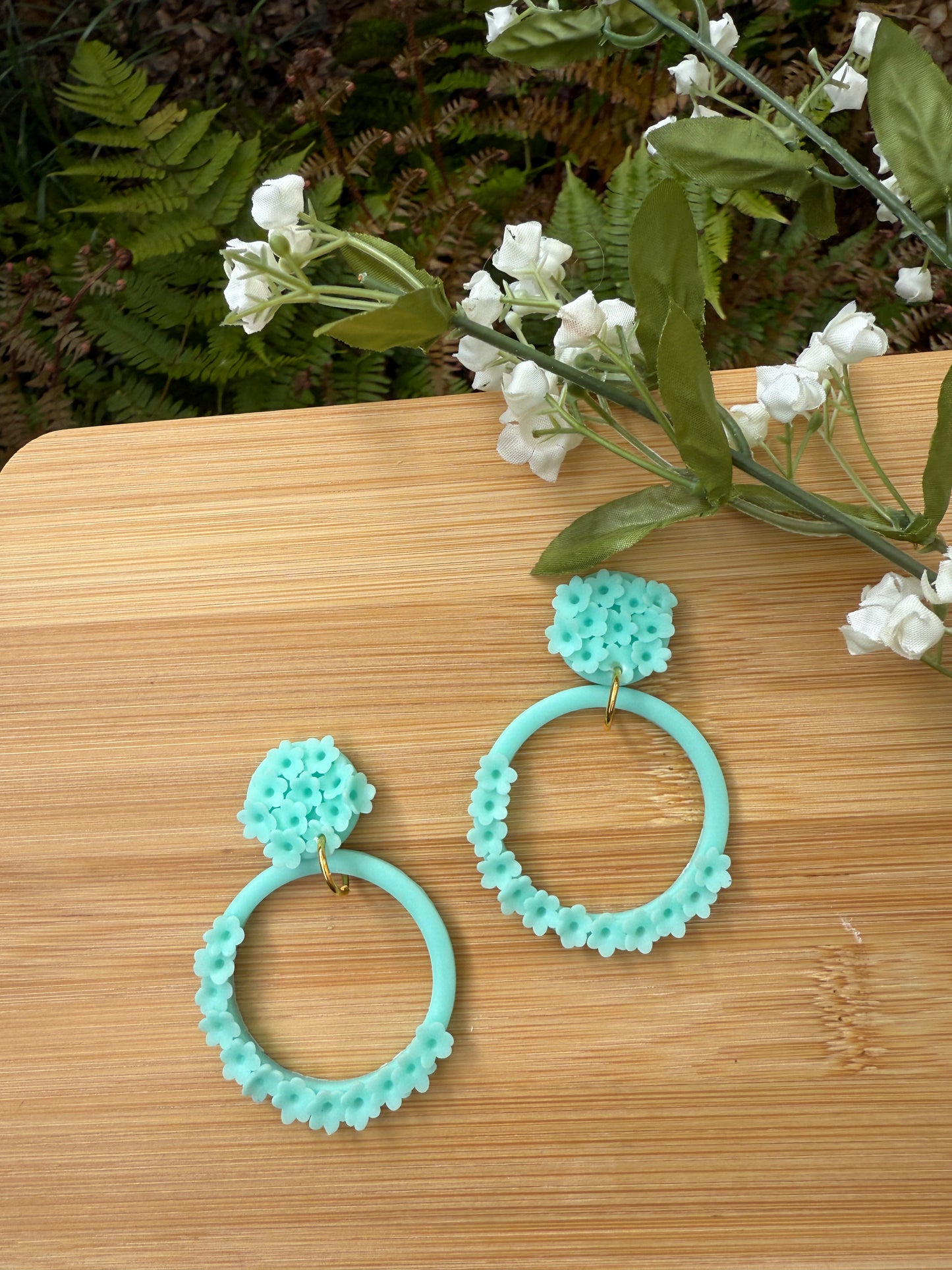 Opaque teal floral hoops